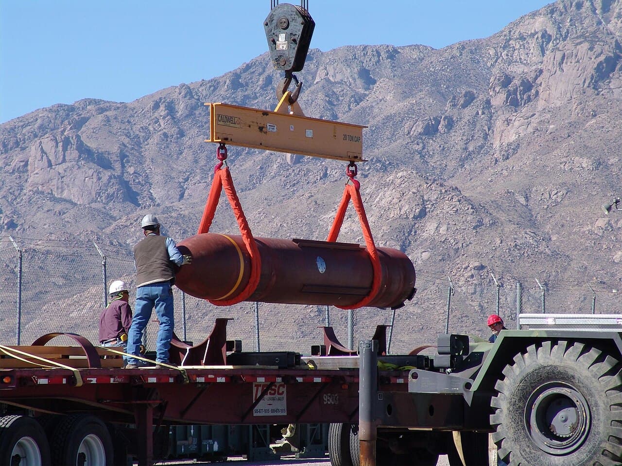 Ground crew moving a Massive Ordnance Penetrator during how bunker buster bombs work mission preparation