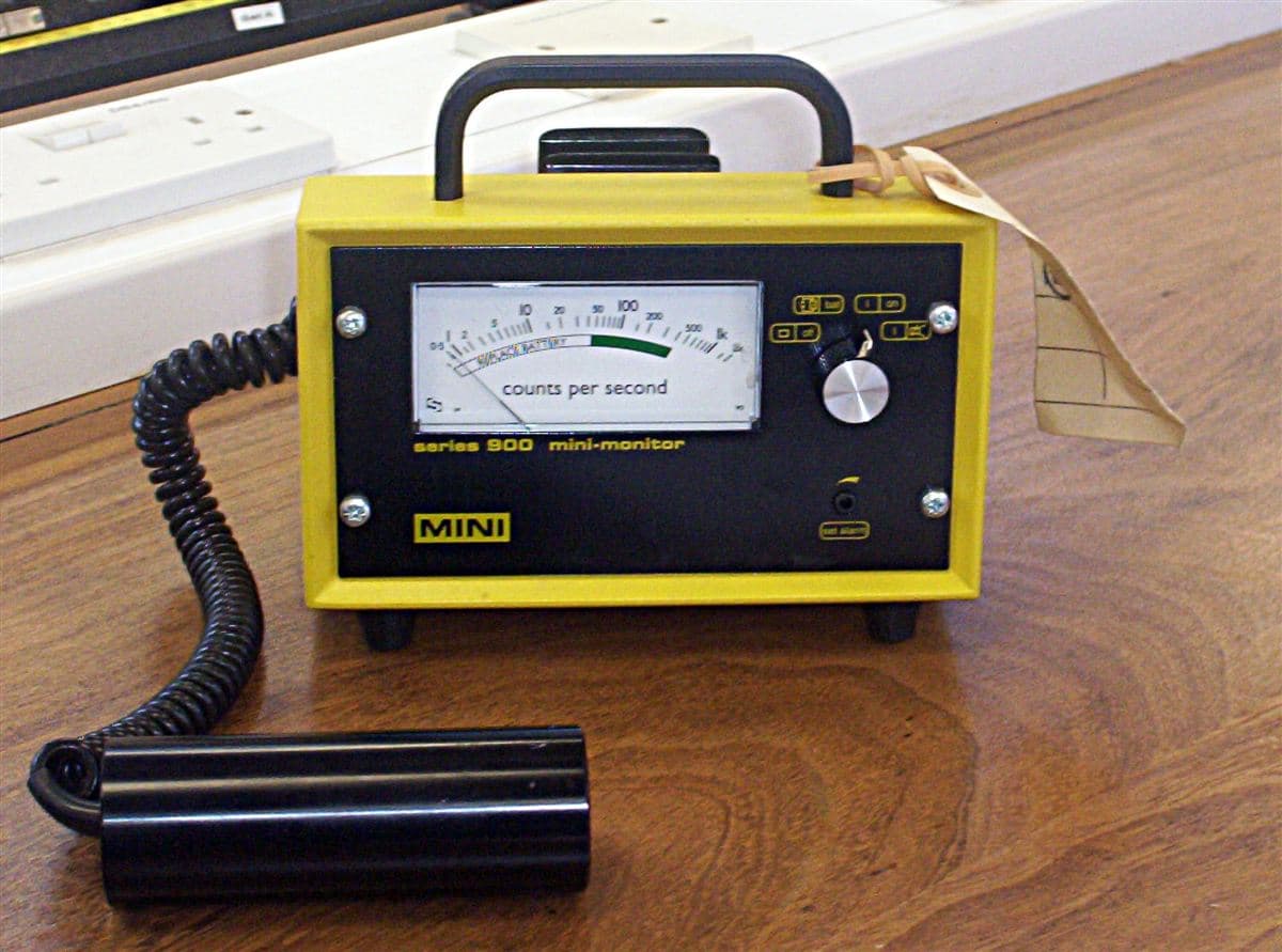 Geiger counter measuring radiation during nuclear fallout timeline assessment