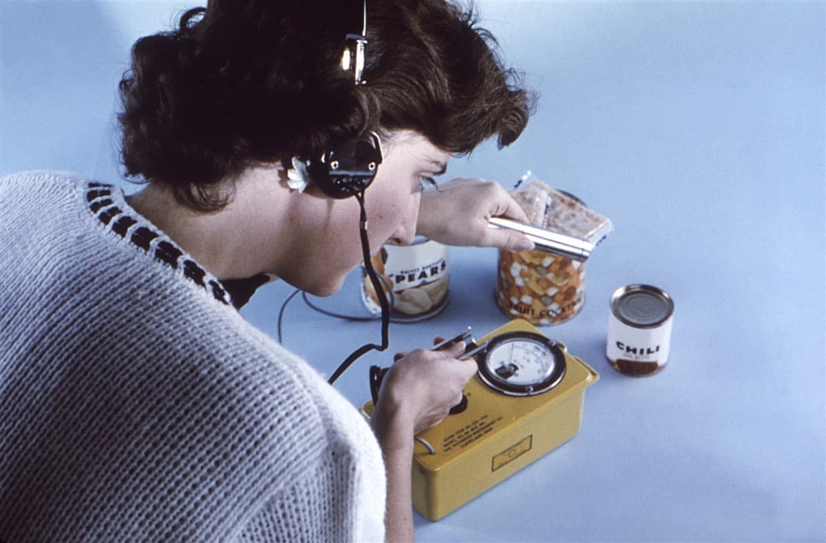 Using a geiger counter during nuclear fallout decontamination to check contamination zones