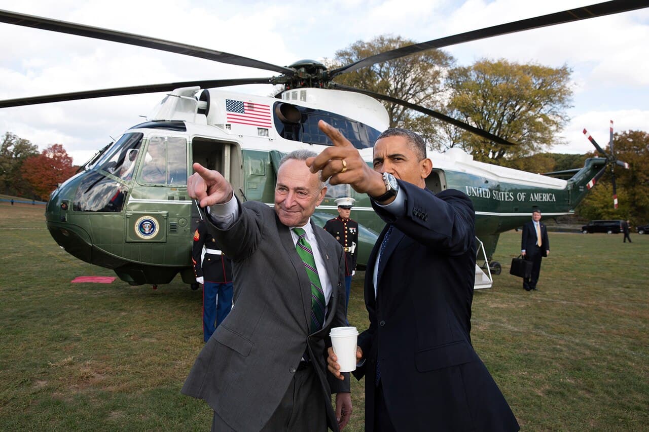 Military aide carrying the nuclear football during a presidential movement