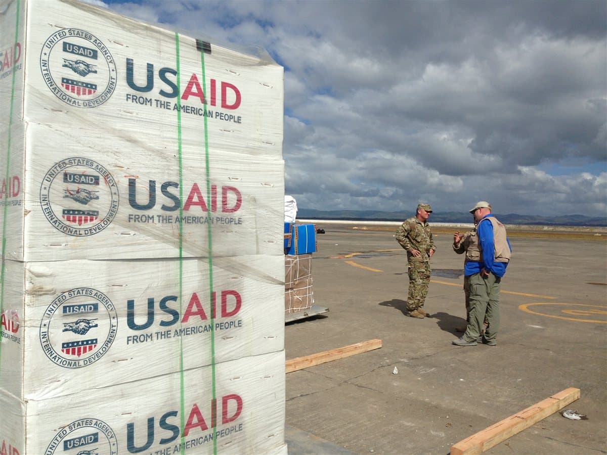 Emergency supplies staged for a nuclear shelter checklist in a home