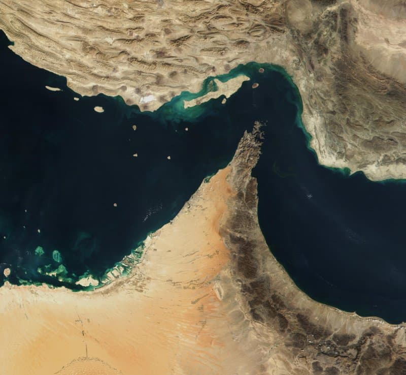 Satellite view of the Strait of Hormuz, the narrow waterway between Iran and Oman through which 20% of global oil supply passes