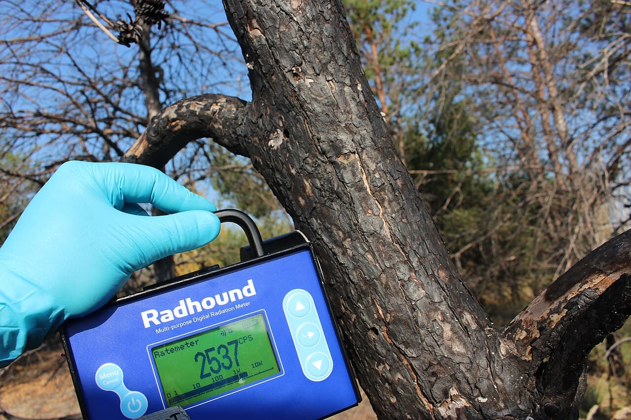 Geiger counter used in a contaminated area during radiation sickness symptoms timeline response