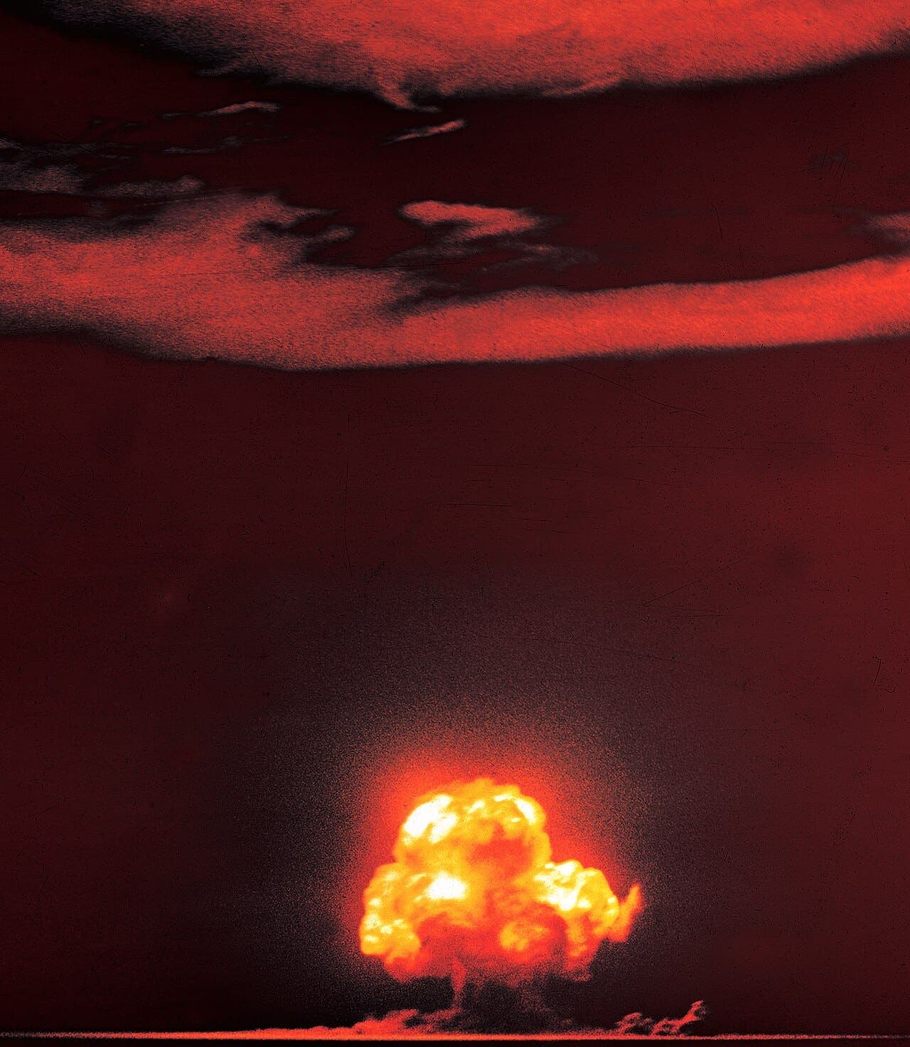 The Trinity test fireball, photographed approximately 0.016 seconds after detonation on July 16, 1945, in the New Mexico desert — the first nuclear explosion in human history